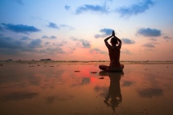 Woman practicing Yoga Pranayama in the cathedral of nature