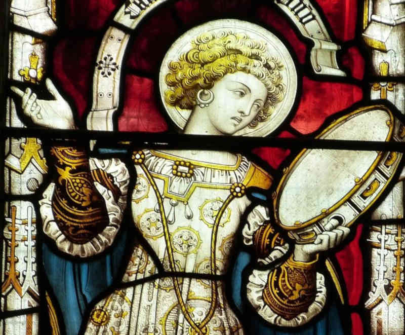 Drummer depicted in stained glass window.